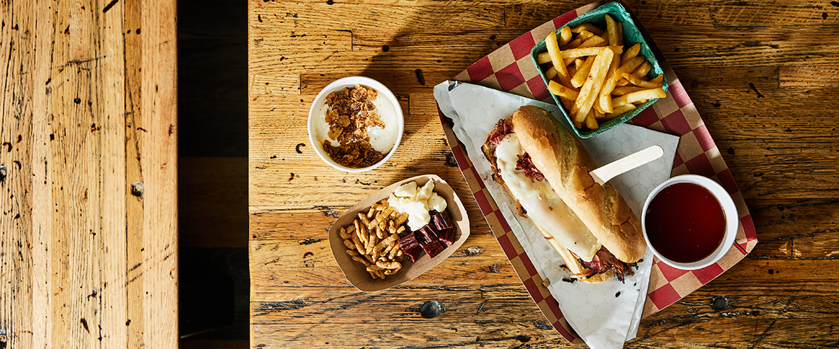 Sandwich on wood table at Pigwich